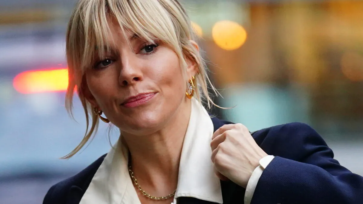 Sienna Miller arrives at the Rolls Building in London, on Dec. 9, 2021. (Victoria Jones/PA via AP)