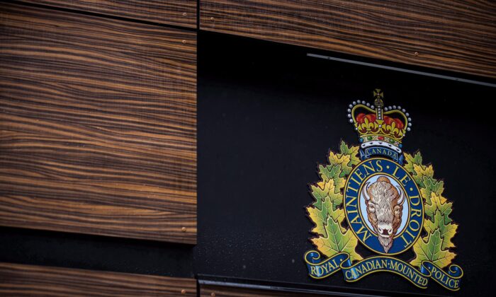 The RCMP logo is seen outside Royal Canadian Mounted Police "E" Division Headquarters, in Surrey, B.C., on April 13, 2018. (Darryl Dyck/The Canadian Press)