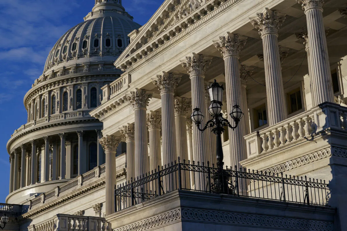 Light from the morning sun illuminates the Capitol on Dec. 3, 2021. (J. Scott Applewhite/AP Photo)