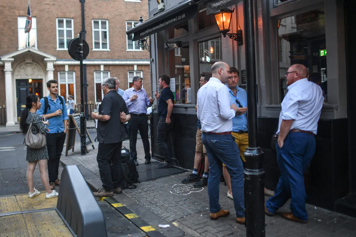 Office workers drink outside a pub in London, on Sept. 8, 2021. (Peter Summers/Getty Images)