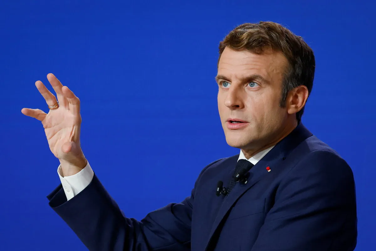 French President Emmanuel Macron delivers a speech during a news conference on France assuming EU presidency, in Paris, France, on Dec. 9, 2021. (Ludovic Marin/Pool via Reuters)
