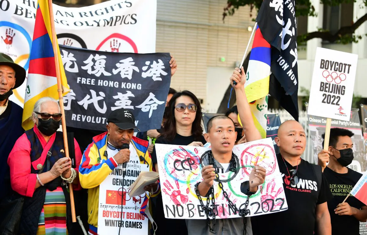 Activists rally in front of the Chinese Consulate, calling for a boycott of the 2022 Beijing Winter Olympics due to concerns over China's human rights record, in Los Angeles, Calif., on Nov. 3, 2021. (Frederic J. Brown/Getty Images)