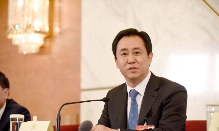 Xu Jiayin, Standing Committee Member of the 12th CPPCC National Committee and Chairman of the Board of Evergrande Group speaks during a news conference on the sidelines of the fourth session of the 12th National People's Congress, on March 6, 2016 in Beijing, China. (Etienne Oliveau/Getty Images)
