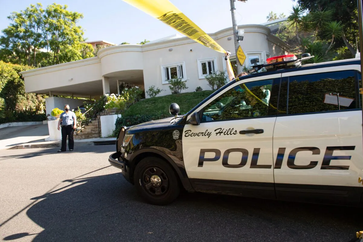 Police tape blocks access to the scene of a burglary and shooting in Beverly Hills, Calif., on Dec. 1, 2021. (Valerie Macon/AFP via Getty Images)