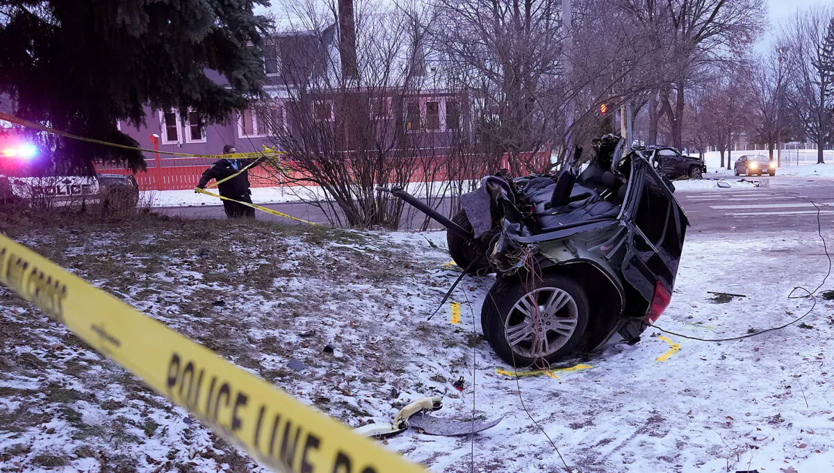 A vehicle sits in two pieces after a stolen vehicle crashed in Minneapolis, Minn., on Dec. 9, 2021. (David Joles/Star Tribune via AP)