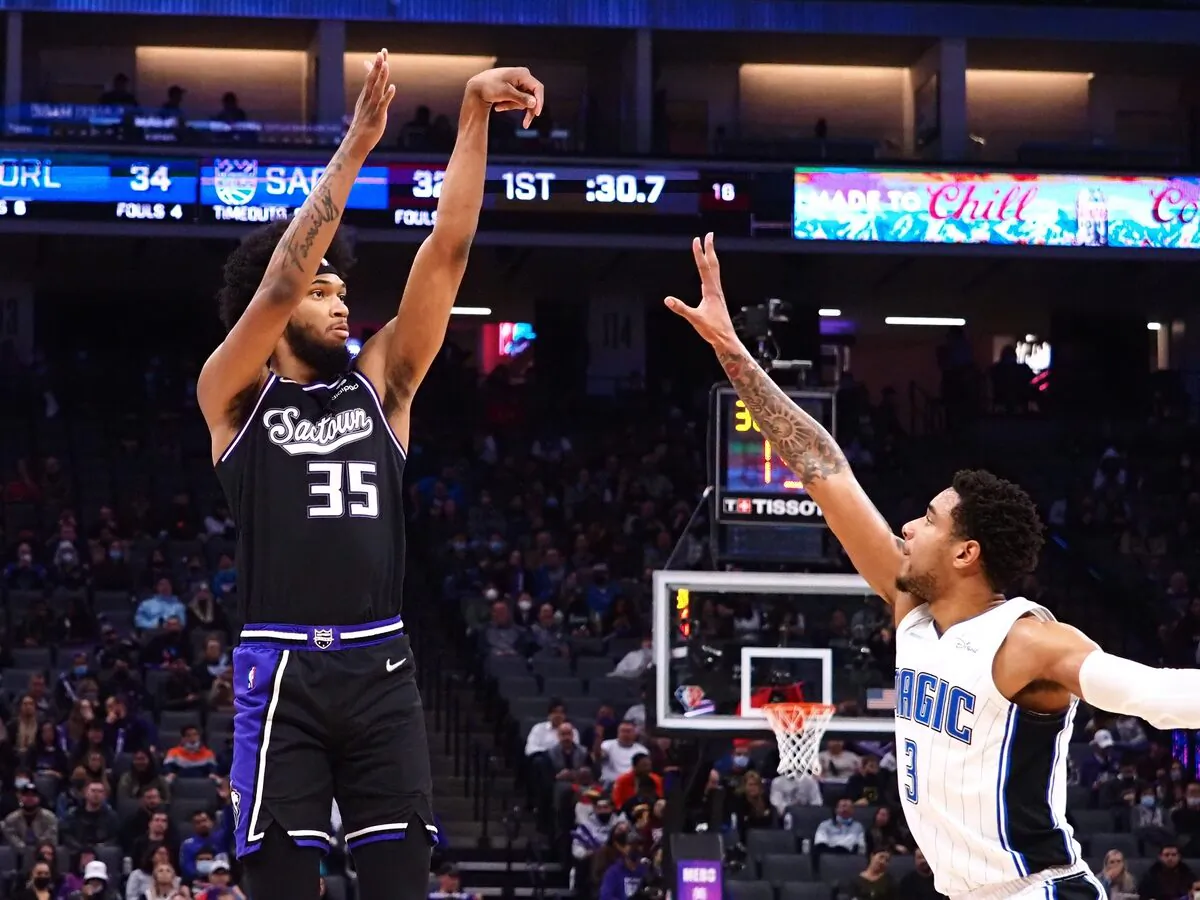 Sacramento Kings forward Marvin Bagley III (35) scores a three point basket against Orlando Magic forward Chuma Okeke (3) during an NBA game at Golden 1 Center, in Sacramento, Calif., on Dec. 8, 2021. (Kelley L Cox/USA TODAY Sports via Field Level Media)