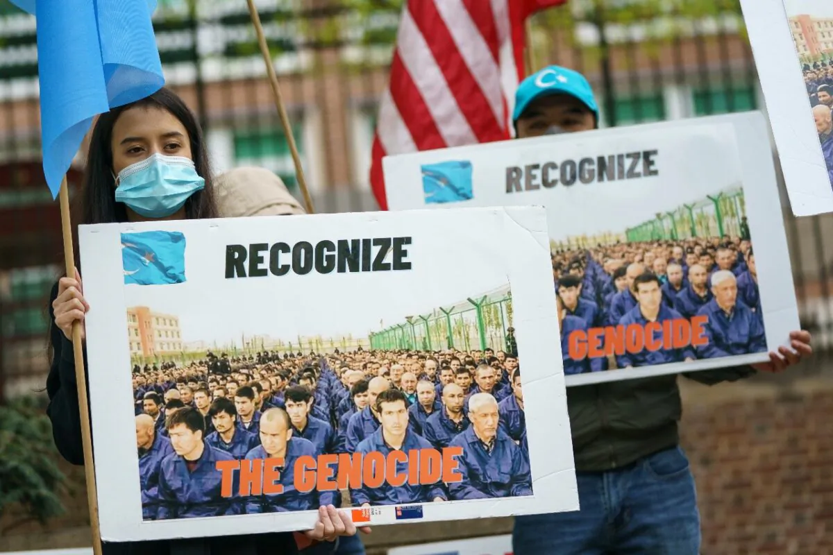 Supporters of the East Turkistan National Awakening Movement rally in front of the British Embassy on April 16, 2021, in Washington. The group is calling for Uyghurs and other Turkic people fleeing Xinjiang to be granted refugee status and calling for an international boycott of the 2022 Winter Olympic Games in Beijing. (Drew Angerer/Getty Images)