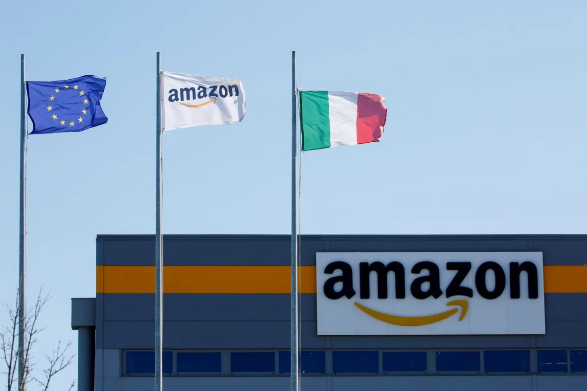 Flags flutter outside a distribution centre, during a strike at Amazon's logistics operations in Passo Corese, Italy, on March 22, 2021. (Remo Casilli/Reuters)