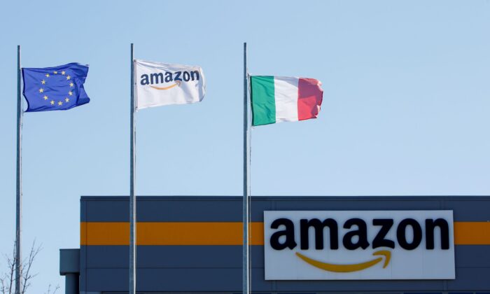 Flags flutter outside a distribution centre, during a strike at Amazon's logistics operations in Passo Corese, Italy, on March 22, 2021. (Remo Casilli/Reuters)