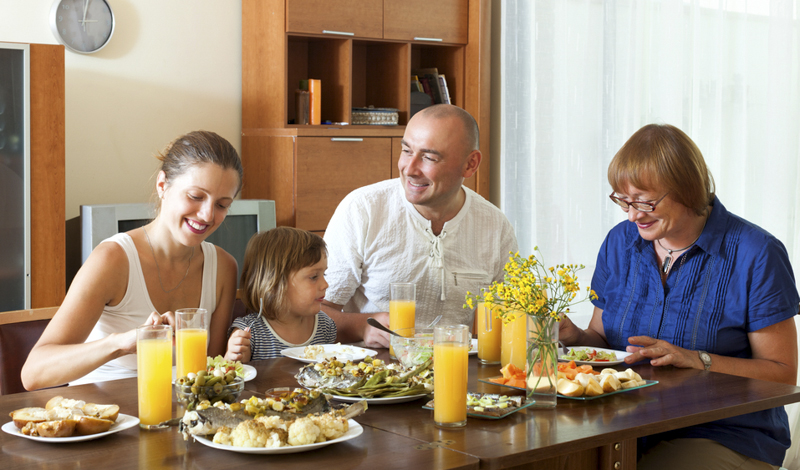Sit down family meals together greatly impact a child's development and well-being. (BearFotos/Shutterstock)