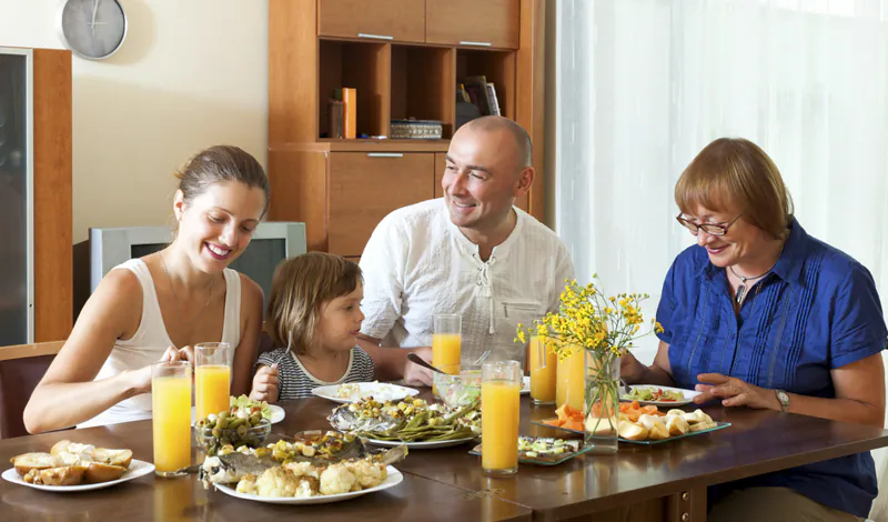 Sit down family meals together greatly impact a child's development and well-being. (BearFotos/Shutterstock)