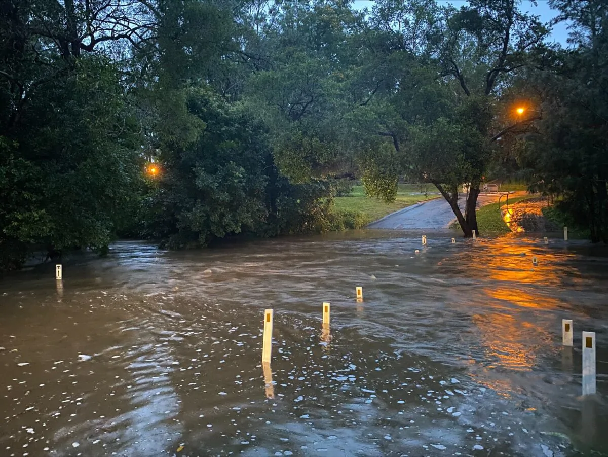 Flooded road in the Brisbane suburb of Brookfield, Australia, obtained on Dec. 10, 2021. (Supplied by Queensland Fire and Emergency Services)