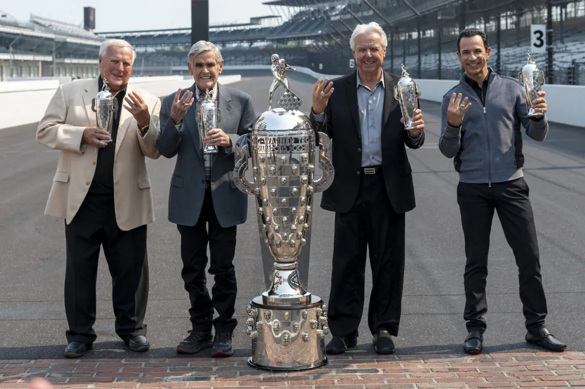 Winner of this year's Indy 500, Helio Castroneves (R) gathered with other four-time winners, from left, A.J. Foyt, Al Unser, and Rick Mears at the Indianapolis Motor Speedway in Indianapolis on July 20, 2021. (Doug McSchooler/AP Photo)