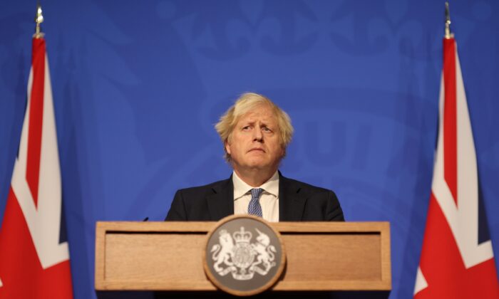 British Prime Minister Boris Johnson gives a press conference at 10 Downing Street on Dec. 8, 2021. (Adrian Dennis -WPA Pool/Getty Images)