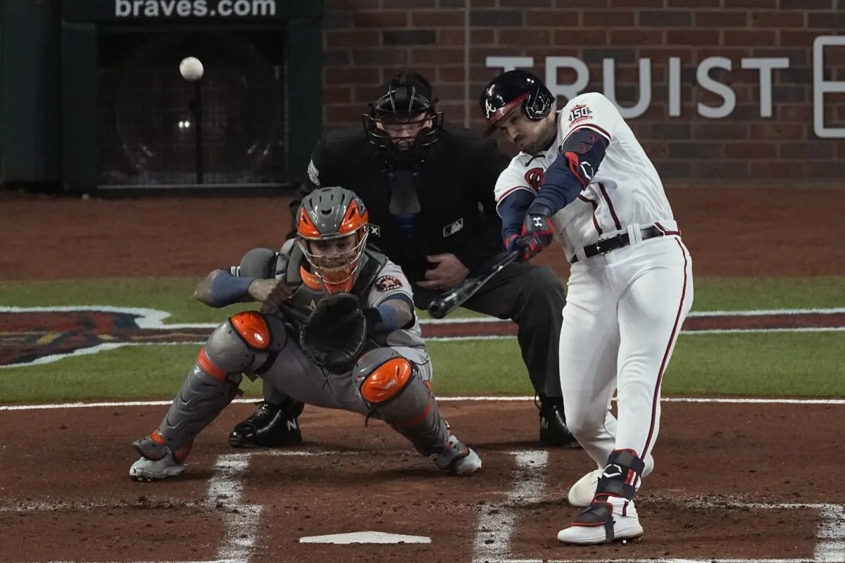 Atlanta Braves' Adam Duvall hits a grand slam home run during the first inning in Game 5 of baseball's World Series between the Houston Astros and the Atlanta Braves, in Atlanta, Oct. 31, 2021. (John Bazemore/AP Photo)