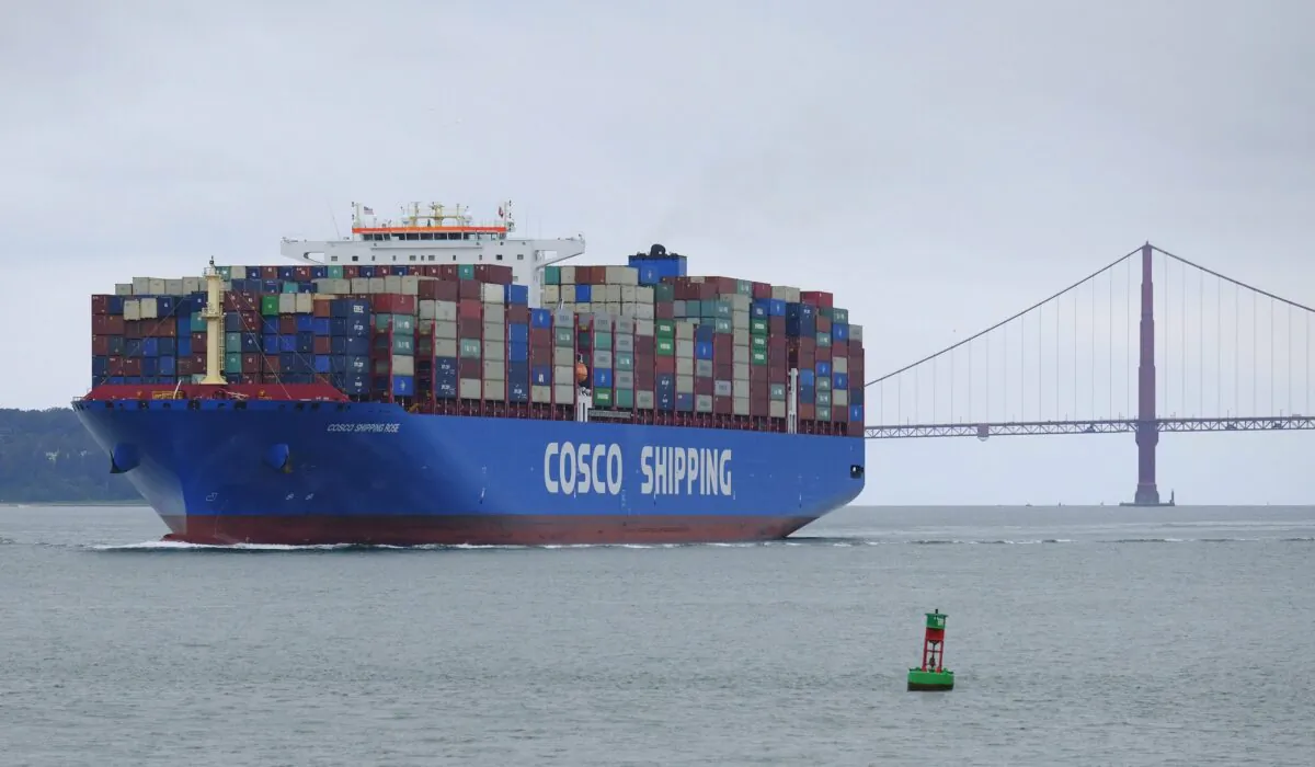 A Cosco Shipping container ship passes the Golden Gate Bridge on May 14, 2019, in San Francisco bound for the Port of Oakland. (AP Photo/Eric Risberg)