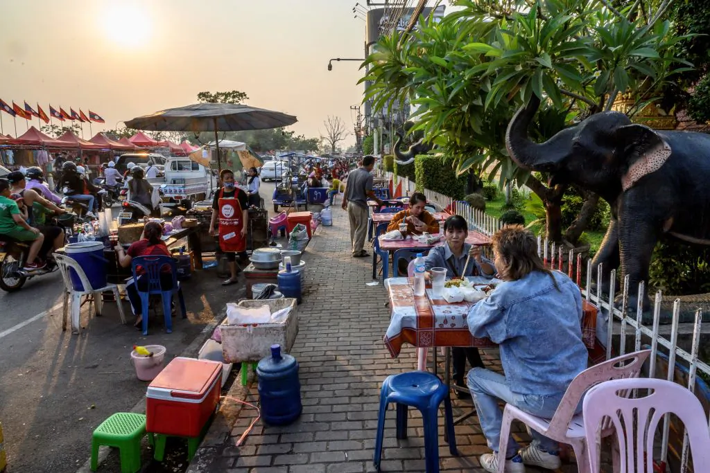 People eating street food in Vientiane, Laos, on March 12, 2020. (Mladen Antonov/AFP via Getty Images)