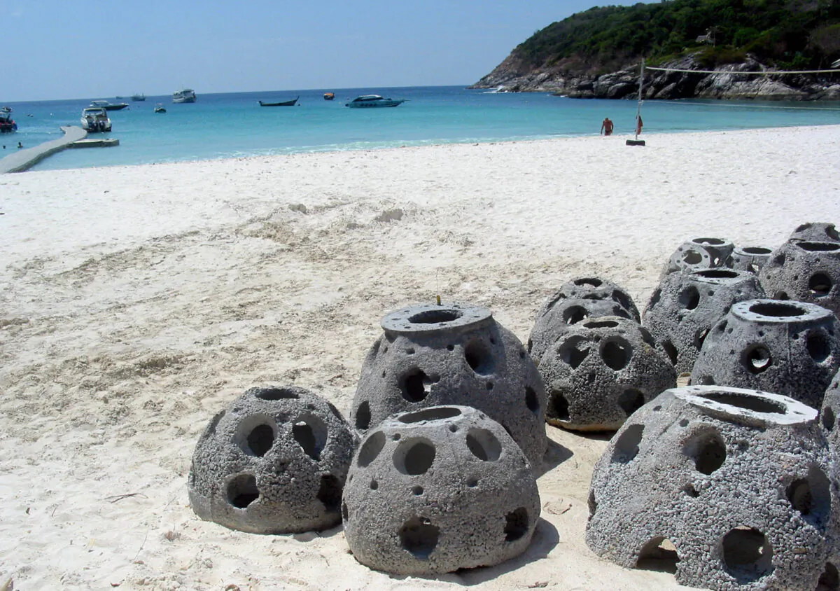 Concrete "reef balls" designed to make artificial coral reefs lie on the sand of Raja island, off the southern tip of Phuket island in Thailand on April 5, 2005. (Michael Mathes/AFP via Getty Images)