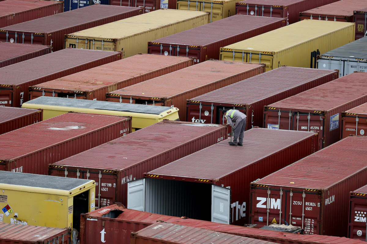 Shipping containers are stacked after being offloaded from a boat in Miami, Florida on Nov. 4, 2021. (Joe Raedle/Getty Images)
