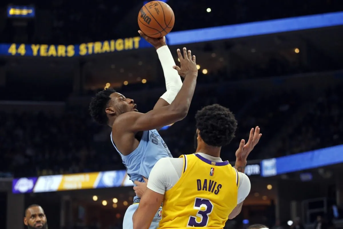 Memphis Grizzles forward Jaren Jackson Jr. (13) shoots over Los Angeles Lakers forward Anthony Davis (3) during the second half at FedExForum in Memphis, Tenn., on Dec. 9, 2021.
 (Petre Thomas/USA TODAY Sports via Field Level Media)