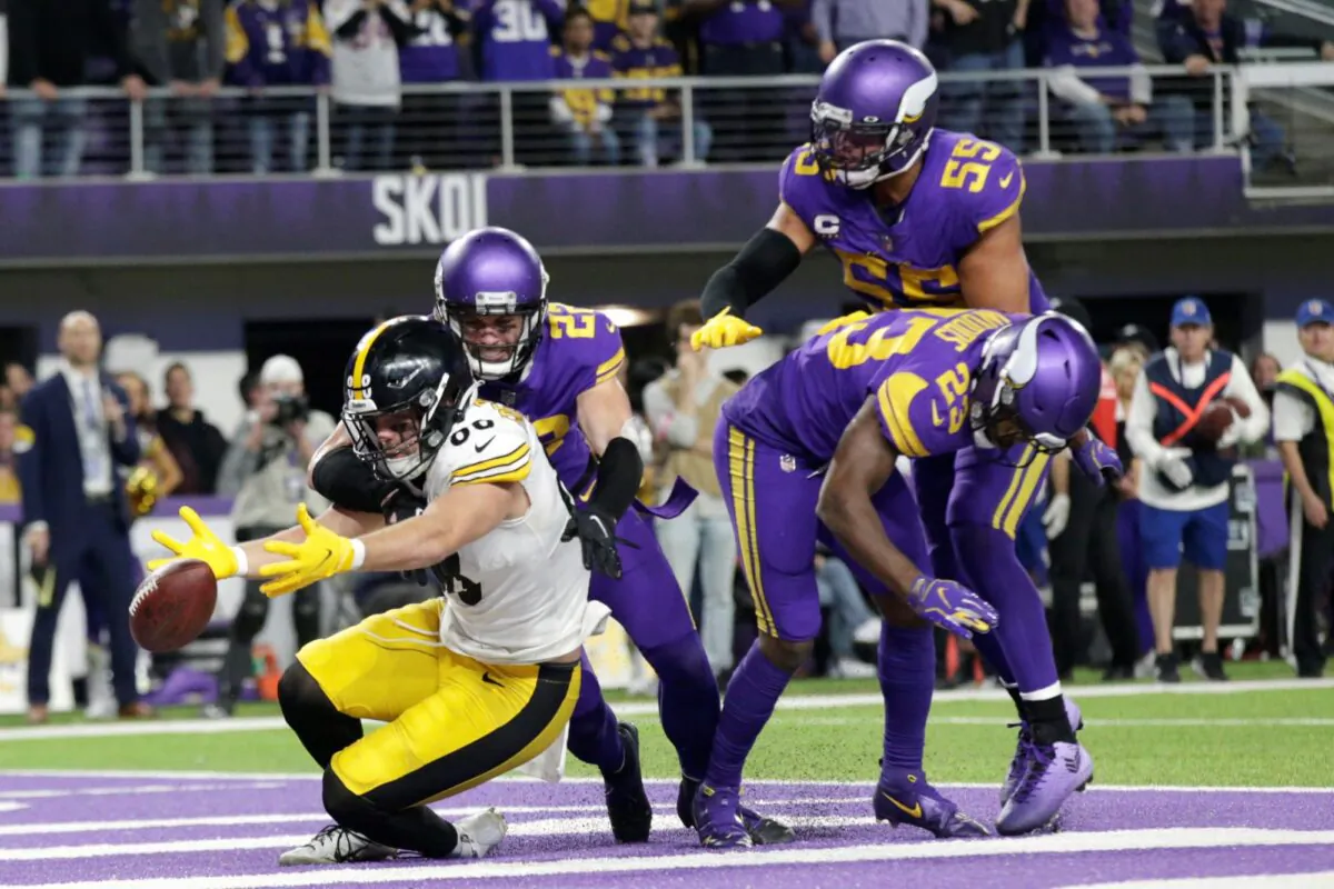 Minnesota Vikings defenders safety Harrison Smith (22), outside linebacker Anthony
Barr (55) and free safety Xavier Woods (23) break up a pass intended for Pittsburgh Steelers tight end Pat Freiermuth (88) in the end zone at the end of an NFL football game in Minneapolis, on Dec. 9, 2021. (Andy Clayton-King/AP Photo)