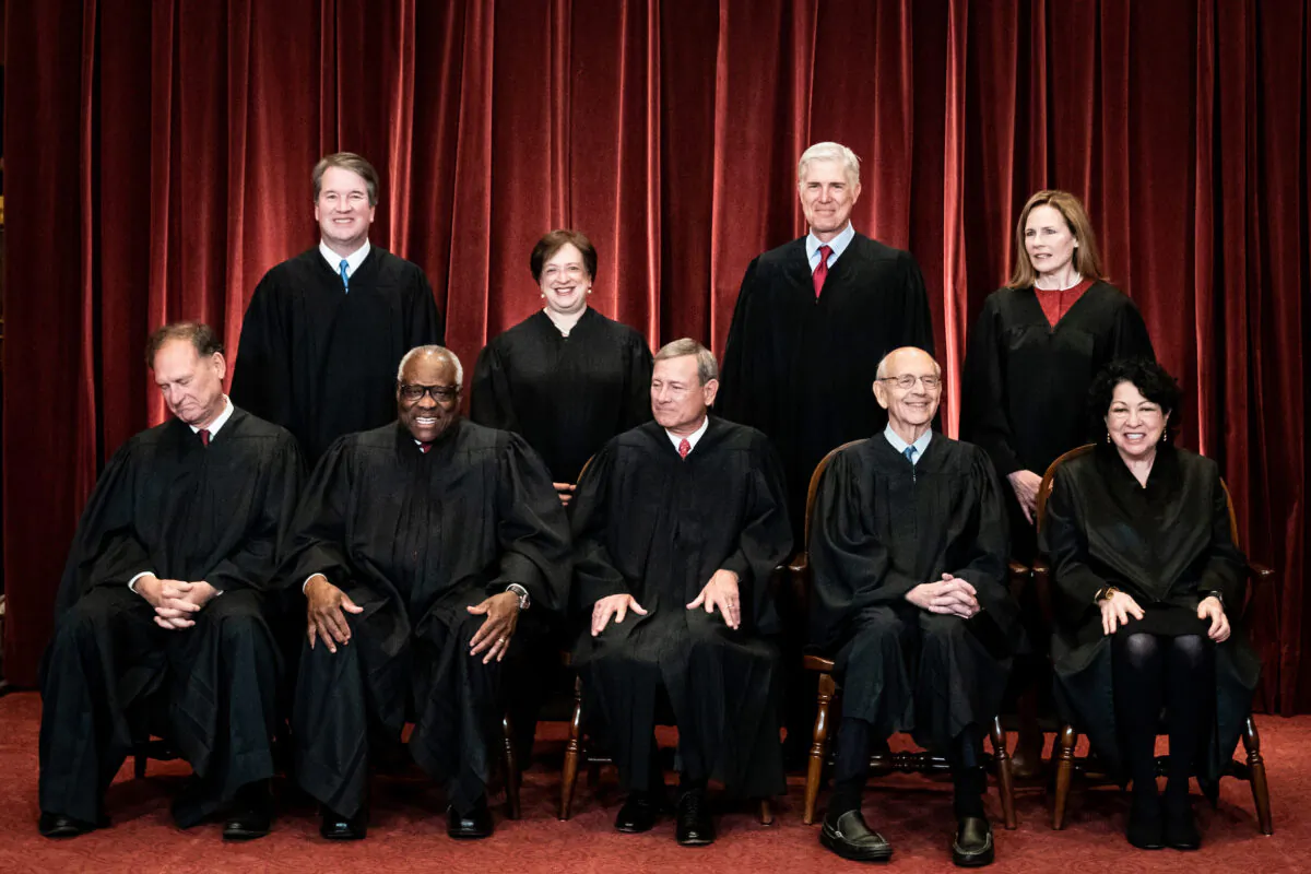 Members of the Supreme Court pose for a group photograph at the Supreme Court in Washington on April 23, 2021. (Erin Schaff/Pool/Getty Images)