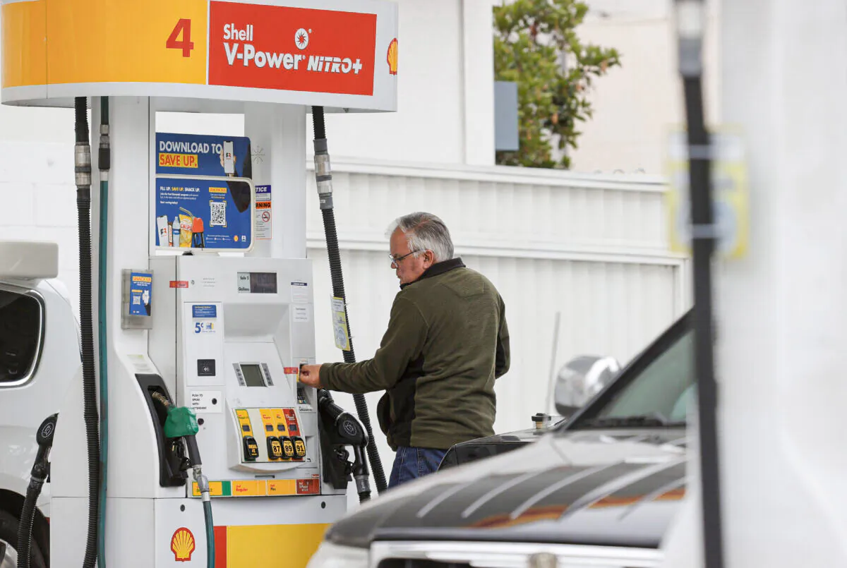 A customer prepares to pump gas at a Shell station in San Francisco on July 12, 2021. (Justin Sullivan/Getty Images)