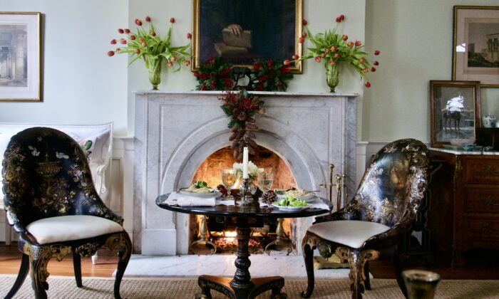 Sitting by the fireplace creates a cozy, relaxed moment to delight in the season. Any small, moveable table works well, dressed up with a nice tablecloth. (Victoria de la Maza)