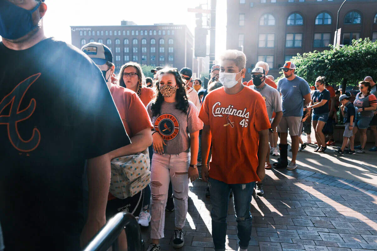 People wearing masks are seen in St. Louis, Mo., in a file photograph. (Spencer Platt/Getty Images)