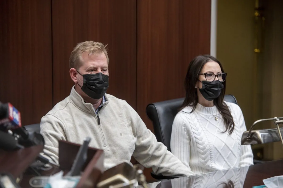 Jeffrey Franz and his wife Brandi listen as attorney Geoffrey Fieger holds a news conference at his offices in Southfield, Mich., on Dec. 9, 2021. (David Guralnick /Detroit News via AP)