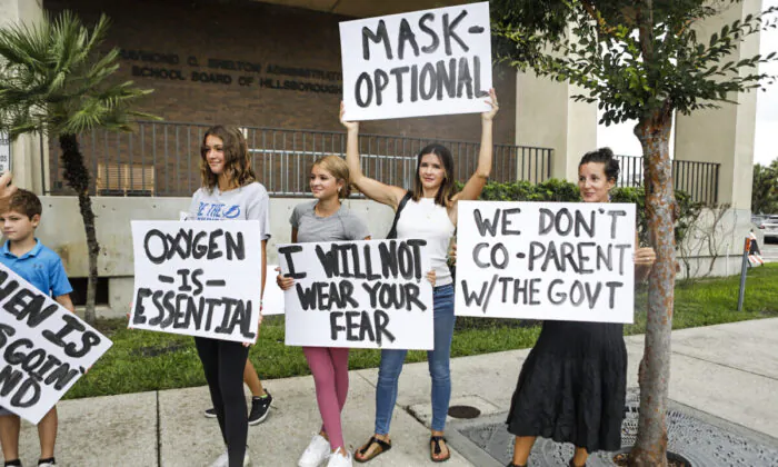 Families protest any potential mask mandates before the Hillsborough County Schools Board meeting held at the district office in Tampa, Fla., on July 27, 2021. (Octavio Jones/Getty Images)