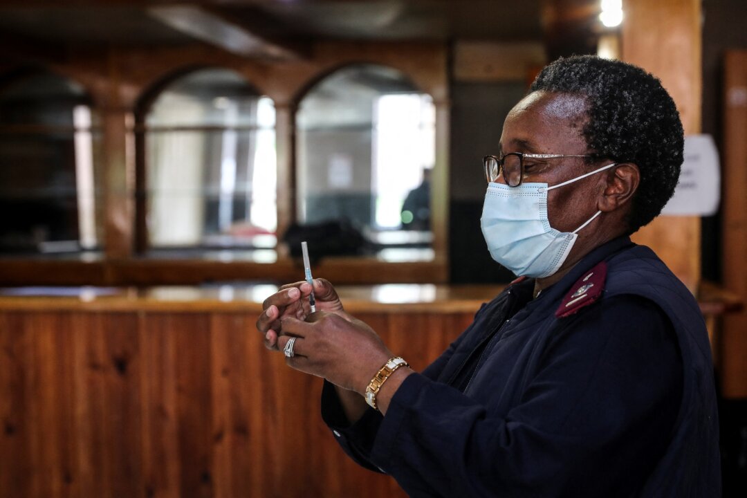 A healthcare worker prepares a dose of Pfizer's COVID-19 vaccine in Johannesburg, South Africa on Dec. 9, 2021. (Sumaya Hisham/Reuters)