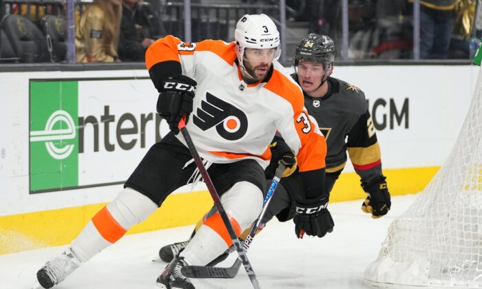 Philadelphia Flyers defenseman Keith Yandle (3) carries the puck ahead of Vegas Golden Knights center Adam Brooks (24) during the second period at T-Mobile Arena in Las Vegas, Nev., on Dec 10, 2021. (Stephen R. Sylvanie-USA TODAY Sports via Field Level Media)