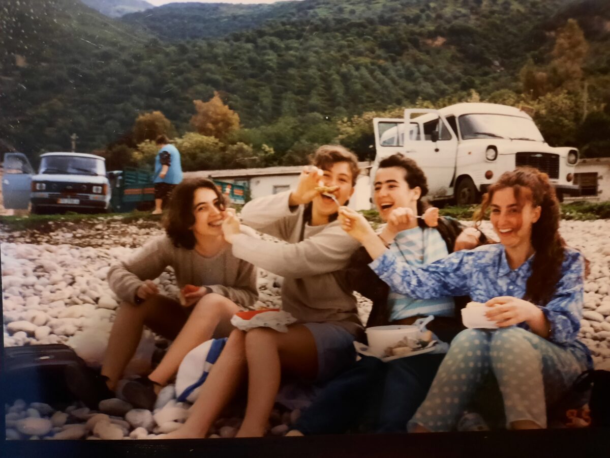 The author and her three best friends share a picnic lunch on the shores of the Ionian Sea during their high school senior year, in May 1996. (Courtesy of Elda Capuni-Lemmon)