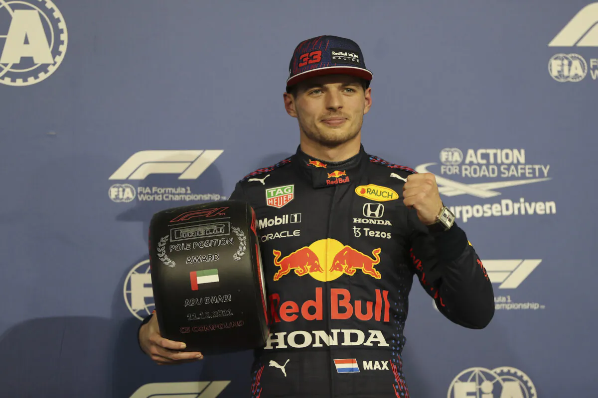 Red Bull driver Max Verstappen of the Netherlands celebrates after winning the pole position for the Formula One Abu Dhabi Grand Prix in Abu Dhabi, United Arab Emirates, on Dec. 11, 2021. (Kamran Jebreili, Pool/AP Photo)