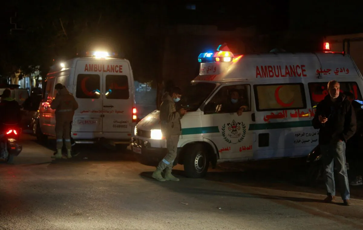 Ambulances are parked at the entrance of the Palestinian camp where an explosion took place, in the southern Lebanese port city of Tyre, Lebanon, on Dec. 10, 2021. (Aziz Taher/Reuters)