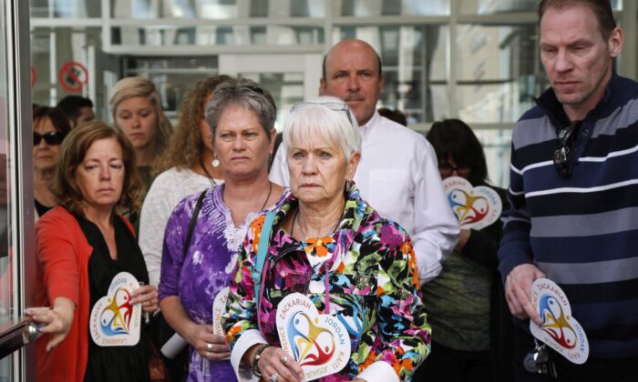 Family members of the victims killed by Matthew de Grood leave court in Calgary on May 25, 2016. De Grood killed five young people with a kitchen knife at a house party in April 2014. (The Canadian Press/Jeff McIntosh)