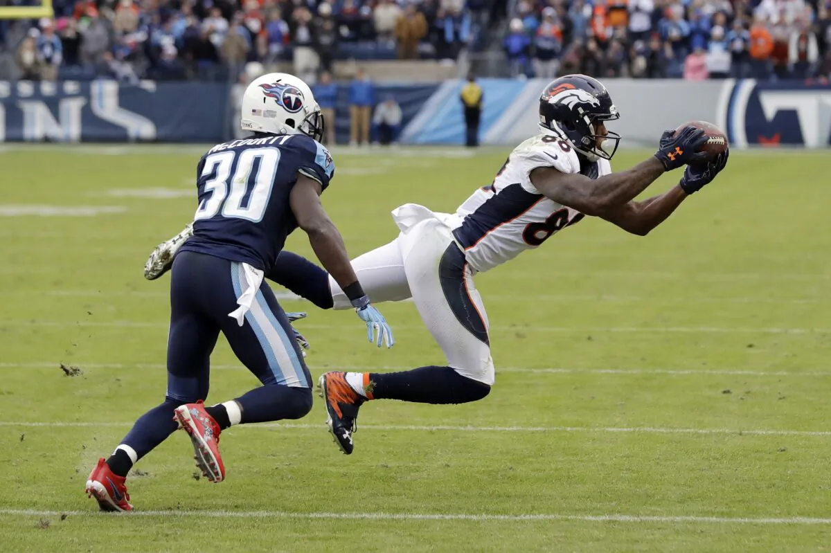 Denver Broncos wide receiver Demaryius Thomas (88) catches a pass as he is defended by Tennessee Titans cornerback Jason McCourty (30) during the second half of an NFL football game, in Nashville, Tenn., on Dec. 11, 2016. (James Kenney/AP Photo, File)
