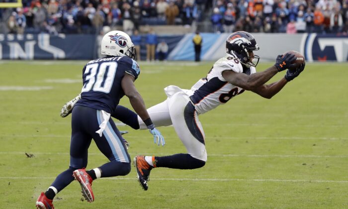 Denver Broncos wide receiver Demaryius Thomas (88) catches a pass as he is defended by Tennessee Titans cornerback Jason McCourty (30) during the second half of an NFL football game, in Nashville, Tenn., on Dec. 11, 2016. (James Kenney/AP Photo, File)