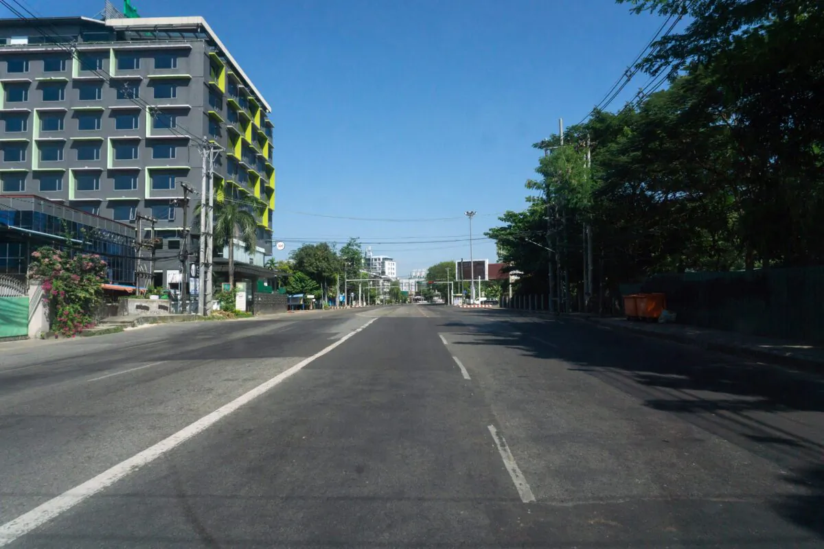 An empty street is pictured as demonstrators called for a "silent strike" in protest against the military coup in Yangon on Dec. 10, 2021. (STR/AFP via Getty Images)