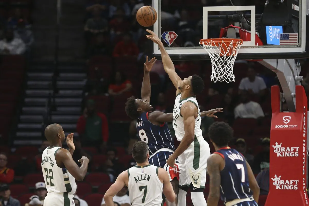 Milwaukee Bucks forward Giannis Antetokounmpo (34) blocks Houston Rockets forward Jae'Sean Tate (8) shot in the first quarter at Toyota Center in Houston, Texas, on Dec 10, 2021. (Thomas Shea/USA TODAY Sports via Field Level Media)