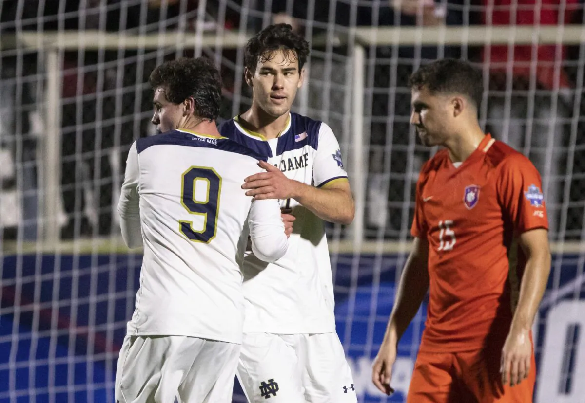 Notre Dame's Jack Lynn (C) celebrates with teammate Tyler Shea (9) during a soccer game in Cary, N.C., on Dec. 10, 2021. (Ben McKeown/AP Photo)