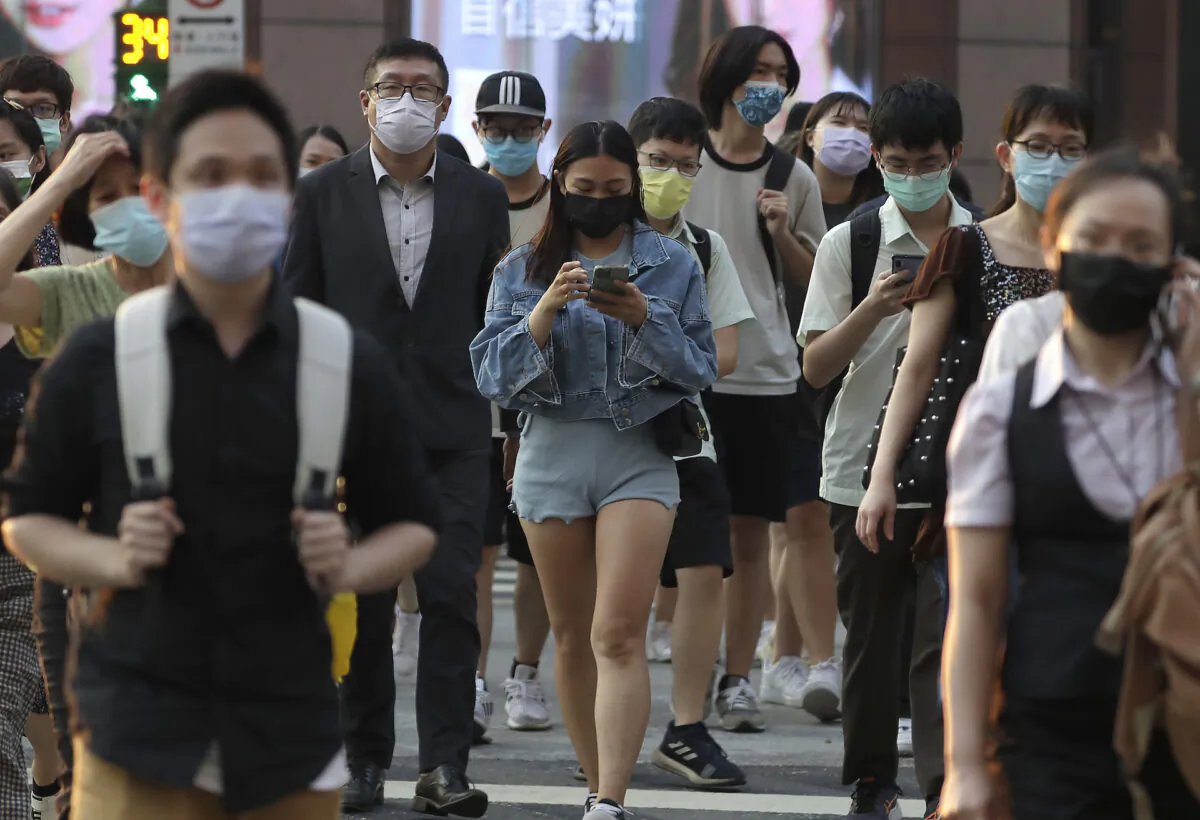 People wear face masks to protect against the spread of the coronavirus in Taipei, Taiwan, Sept. 30, 2021. (Chiang Ying-ying/AP Photo)
