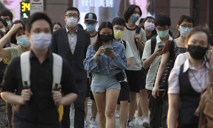 People wear face masks to protect against the spread of the coronavirus in Taipei, Taiwan,  Sept. 30, 2021. (Chiang Ying-ying/AP Photo)