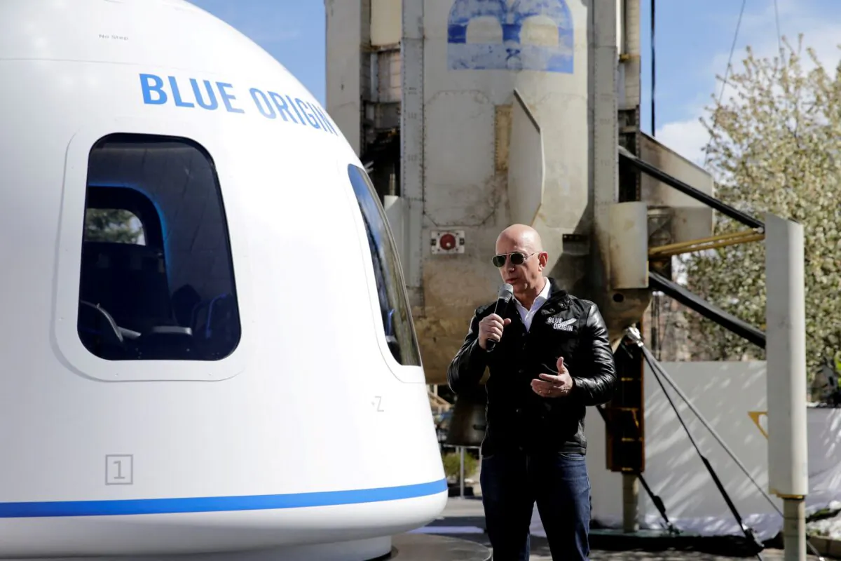 Amazon and Blue Origin founder Jeff Bezos addresses the media about the New Shepard rocket booster and Crew Capsule mockup at the 33rd Space Symposium in Colorado Springs, Colo., on April 5, 2017. (Isaiah J. Downing/Reuters)