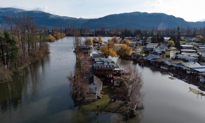 Properties are surrounded by high water after floodwaters began to recede at Everglades Resort on Hatzic Lake near Mission, B.C., December 5, 2021. (The Canadian Press/Darryl Dyck) 