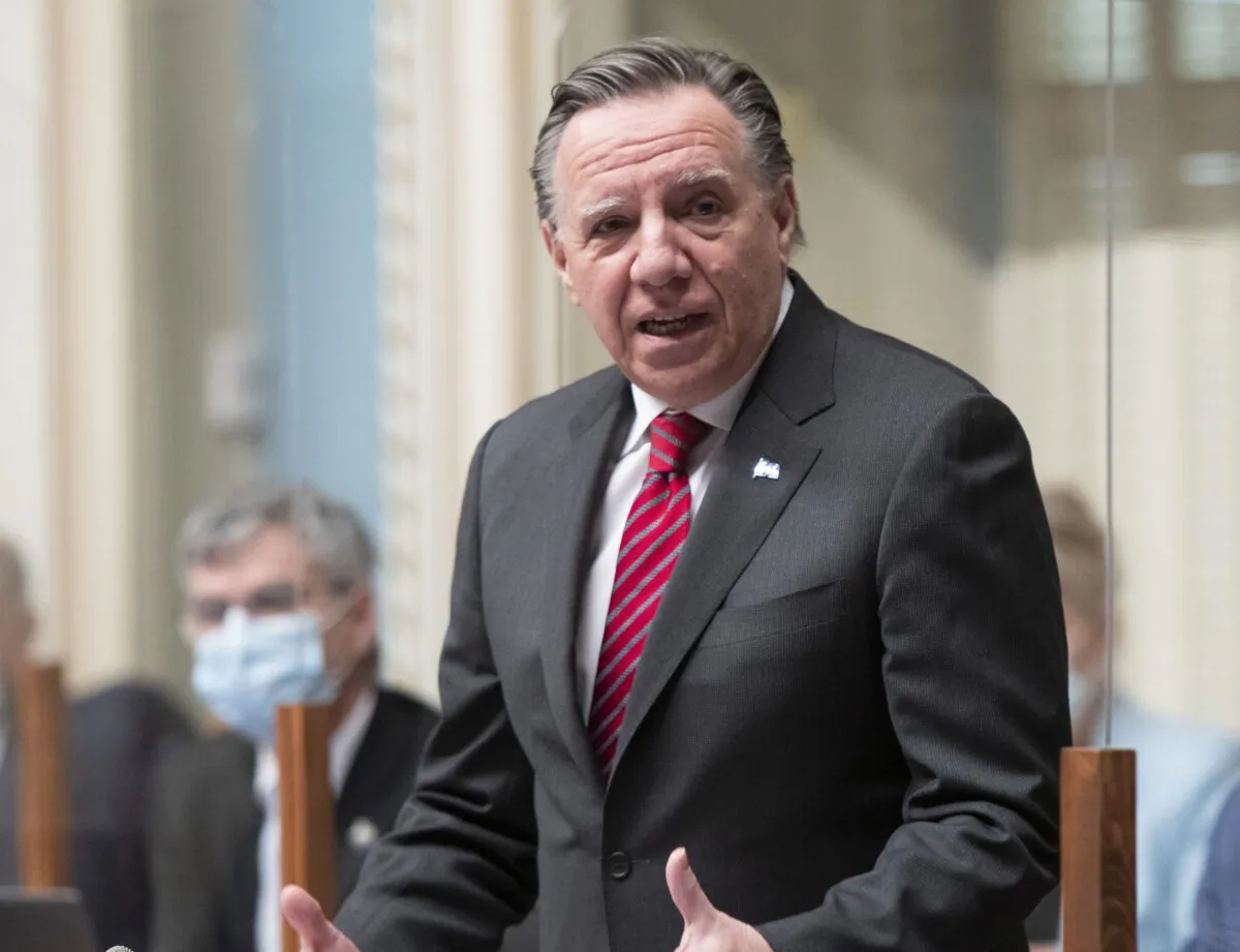 Quebec Premier Francois Legault rises during question period at the legislature in Quebec City on Dec. 8, 2021. (The Canadian Press/Jacques Boissinot)