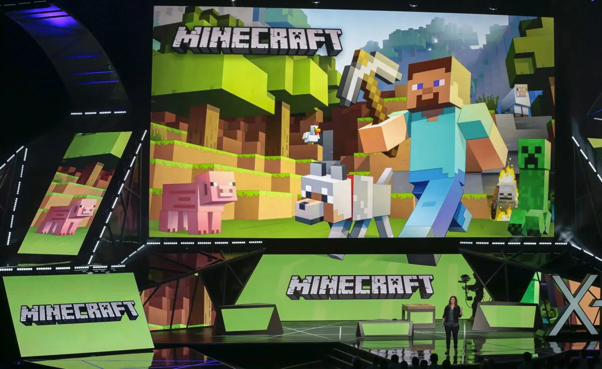 Lydia Winters shows off Microsoft's "Minecraft" built specifically for HoloLens at the Xbox E3 2015 briefing before Electronic Entertainment Expo, in Los Angeles on June 15, 2015. (Damian Dovarganes/AP Photo)