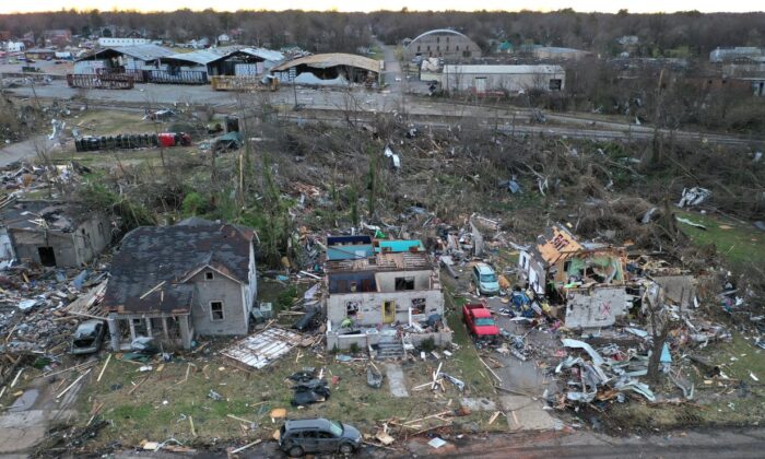  An aerial view of homes and business destroyed by a tornado on December 11, 2021 in Mayfield, Kentucky. Multiple tornadoes touched down in several midwestern states late Friday evening causing widespread destruction and leaving an estimated 70-plus people dead.   (Photo by Scott Olson/Getty Images)