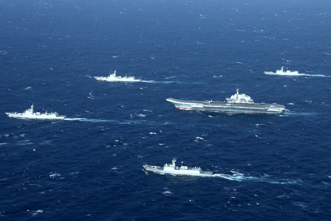 Chinese aircraft carrier Liaoning (C) participates in military drills in the South China Sea on Jan. 2, 2017. (STR/AFP via Getty Images)